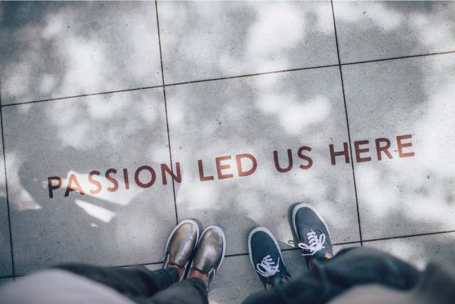 Image looking down at the concrete that says Passion Led Us Here
